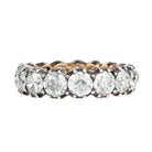 One of our signature designs. Each ring features a unique collection of slightly graduated antique diamonds. Collecting a suite of stones in matched size, color, and clarity often takes months. This ring features sixteen turn-of-the-century, old European cut diamonds, approximately 4.41 carats in total diamond weight The diamond grades range from approximately H-J color and VS-SI clarity. Side view.