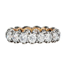 One of our signature designs. Each ring features a unique collection of slightly graduated antique diamonds. Collecting a suite of stones in matched size, color, and clarity often takes months. This ring features sixteen turn-of-the-century, old European cut diamonds, approximately 4.41 carats in total diamond weight The diamond grades range from approximately H-J color and VS-SI clarity. Side view.