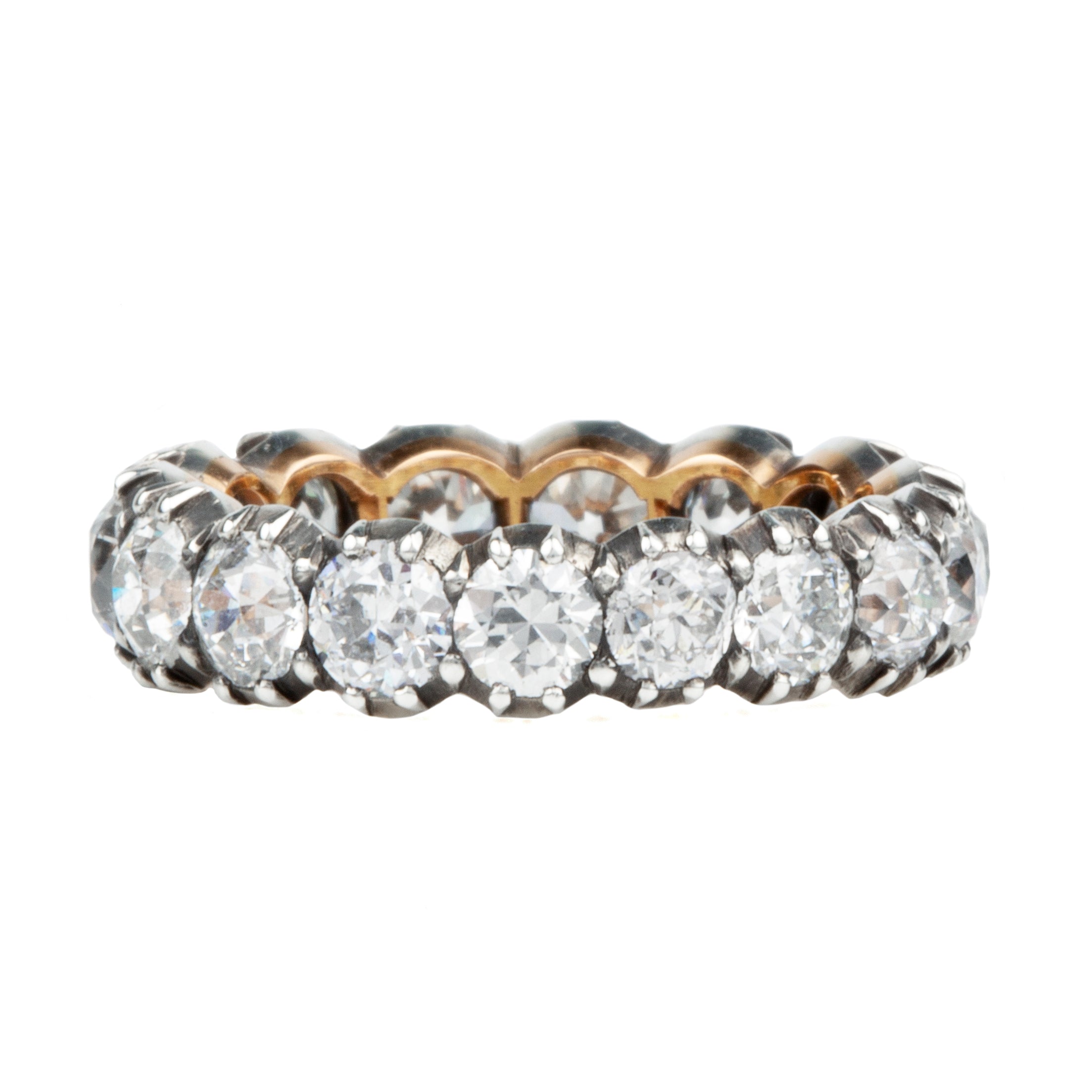 One of our signature designs. Each ring features a unique collection of slightly graduated antique diamonds. Collecting a suite of stones in matched size, color, and clarity often takes months. This ring features sixteen turn-of-the-century, old European cut diamonds, approximately 4.41 carats in total diamond weight The diamond grades range from approximately H-J color and VS-SI clarity. Side view.