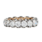 One of our signature designs. Each ring features a unique collection of slightly graduated antique diamonds. Collecting a suite of stones in matched size, color, and clarity often takes months. This ring features sixteen turn-of-the-century, old European cut diamonds, approximately 4.41 carats in total diamond weight The diamond grades range from approximately H-J color and VS-SI clarity. Side view.