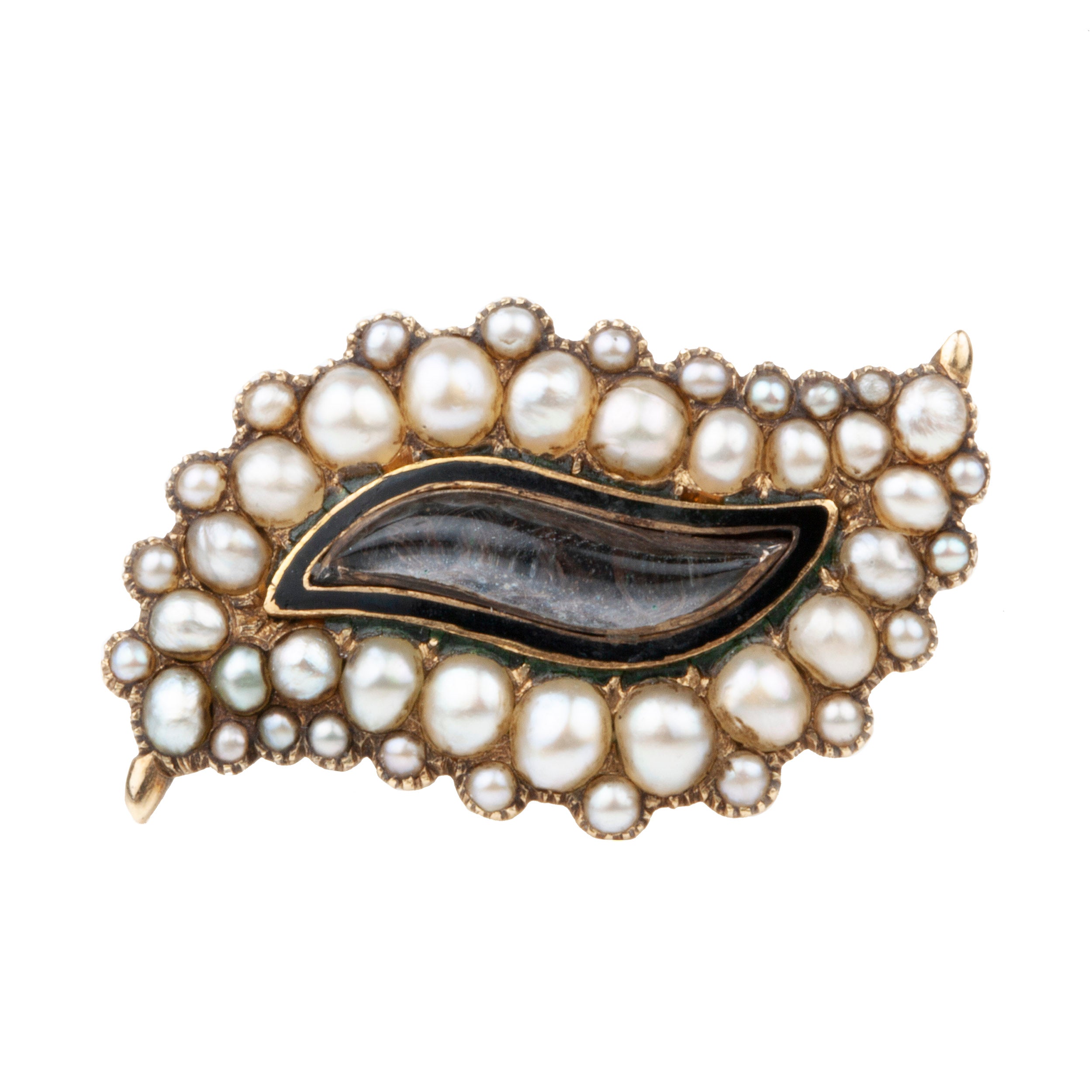 Georgian era brooch in the shape of an eye, in 18k gold with natural pearls and black enamel details. There is a central locket compartment that contains finely woven hair. A very sentimental brooch as the Victorians used seed pearls to signify tears. Engraved "W Harris Thomas. OB 30 July 1826, AE 29 Years". English in origin. Circa 1820. Close-up view for the brooch.
