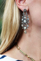 Superb 19th-century diamond earrings in naturalist motifs. Set silver on 18k gold with bright foil-backed settings. The beautiful rose-cut diamonds are estimated to weigh 8 carats in combined weight. There are many hinged elements allowing for lively movement. France, circa 1860. Close up view of the earrings being worn.