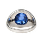 Early 20th-century platinum ring with unique high-domed Sugarloaf cabochon sapphire in a heavy platinum setting. Approximately 5 carat no-heat Ceylon Sapphire with AGL certificate indicating origin and no treatment of any kind. Beautiful cornflower blue with matched step-cut side stones. The center stone has fantastic clarity.Circa 1920.