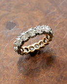 One of our signature designs. Each ring features a unique collection of slightly graduated antique diamonds. Collecting a suite of stones in matched size, color, and clarity often takes months. This ring features sixteen turn-of-the-century, old European cut diamonds, approximately 4.41 carats in total diamond weight The diamond grades range from approximately H-J color and VS-SI clarity. Top view.