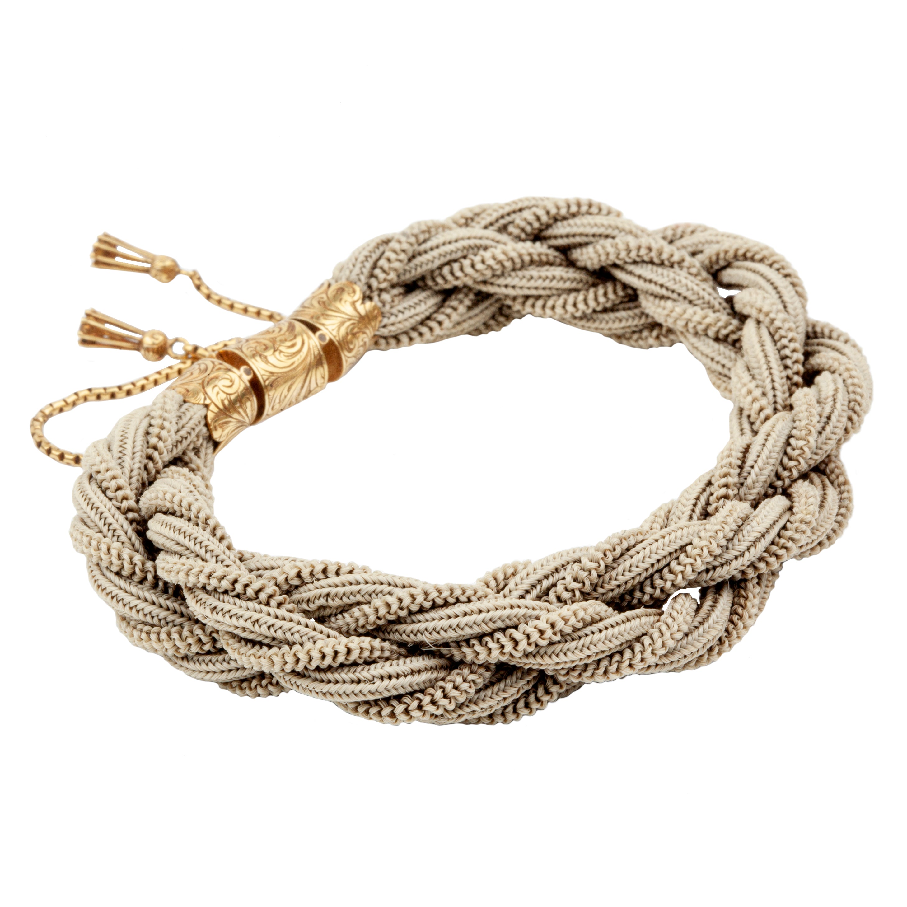 Victorian Era woven hair bracelet, with gold clasp and tassel details. Remarkably preserved twisted woven braids. English in origin. Circa 1860.
