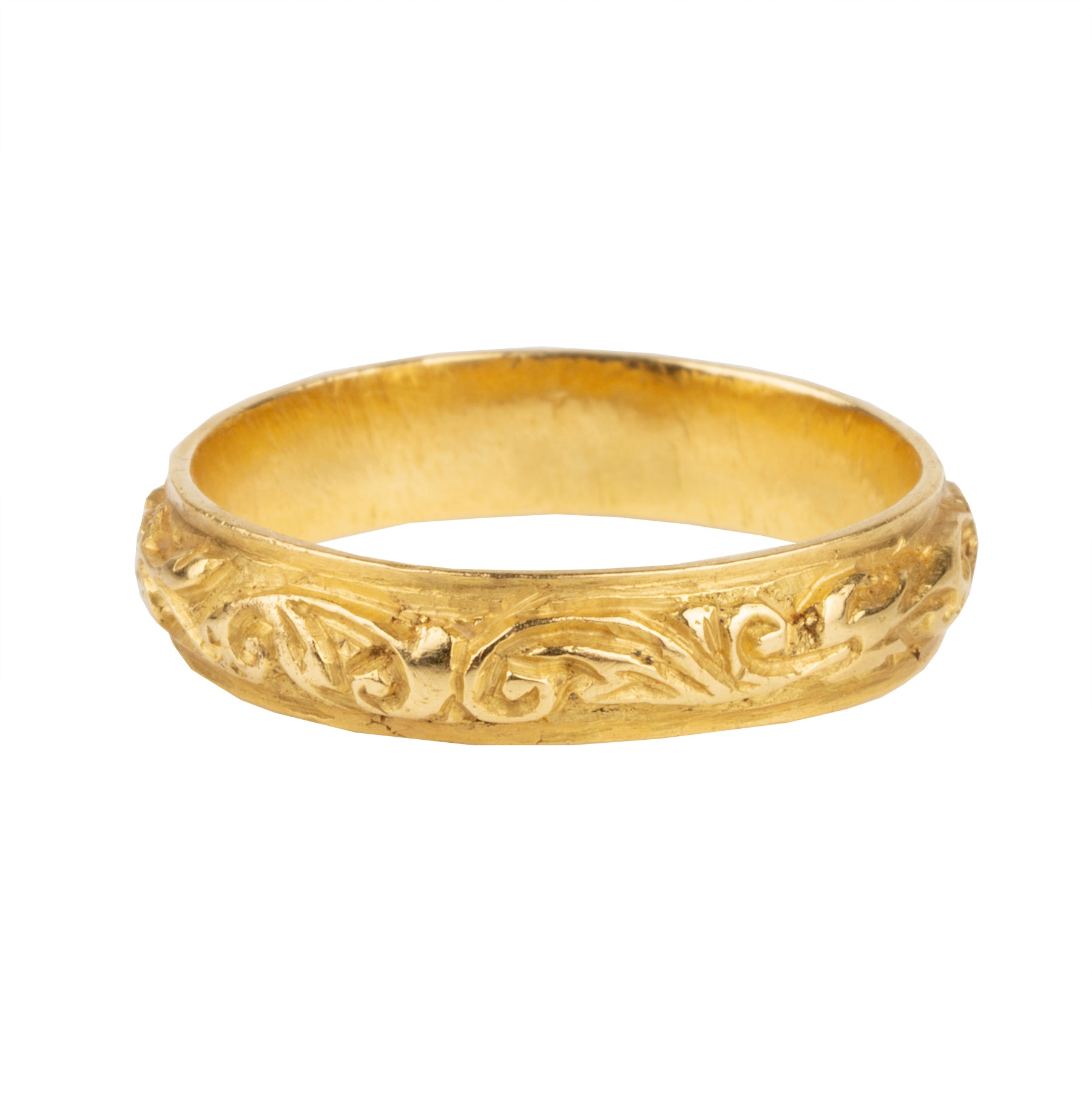 A rare excavated ring. Dating to the late 17th Century in 22k gold, 5mm wide. There would have originally been enamel within the deeply chased design. Excavated in England. Circa 1680.