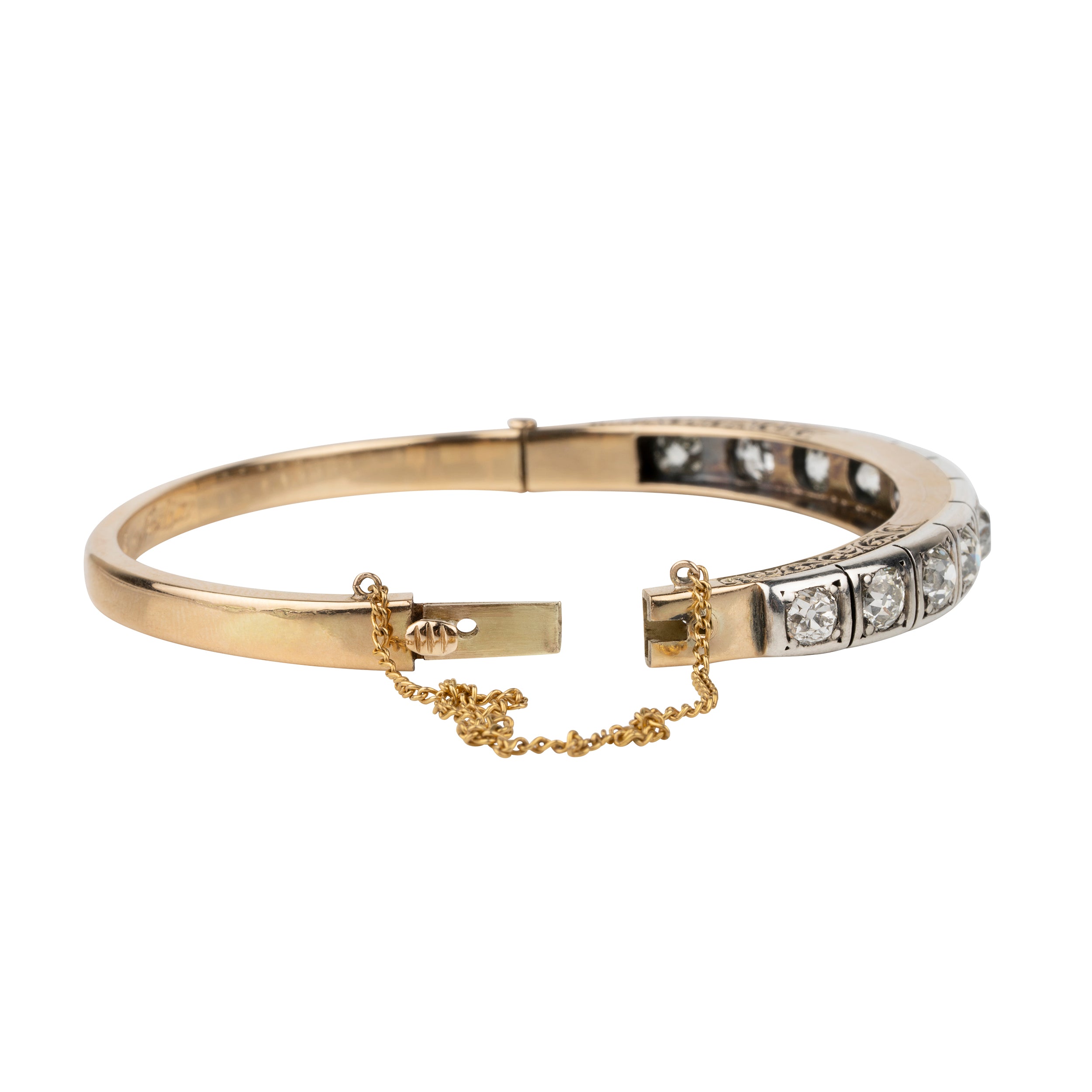 Victorian revival diamond bangle, in silver topped 15k gold. Eleven graduated old European cut diamonds, approximately 4 carats in total diamond weight. Found in Finland. European in origin. Circa 1920.&nbsp;