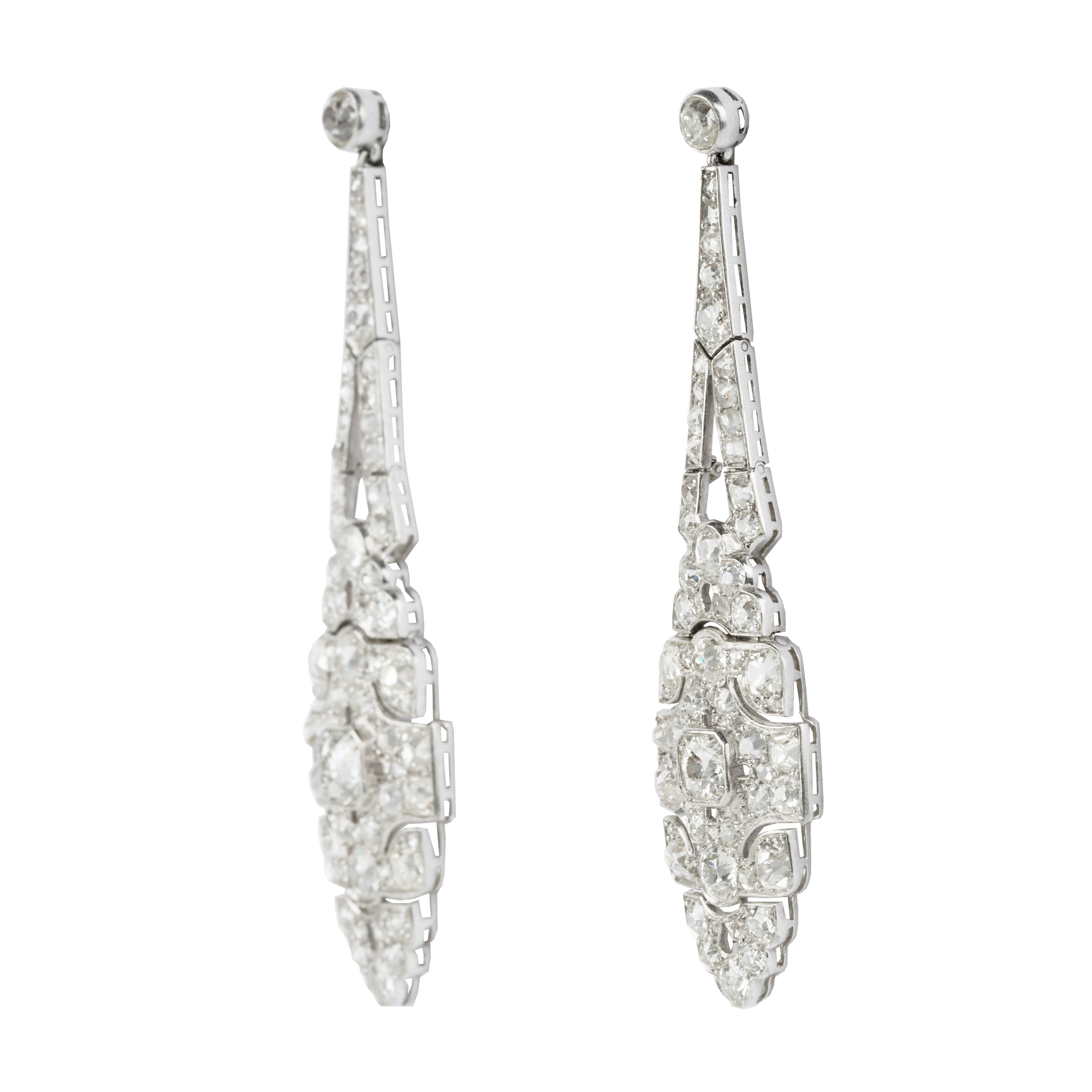 Art Deco Diamond Drop Earrings. A mixture of old mine cut and old European cut diamonds are set in intricate platinum settings. The stones are estimated to weigh approximately 9 carats in total weight. The high-quality stones are estimated to range from F to G in color and VS to SI in quality. America, circa 1920. Side View. 