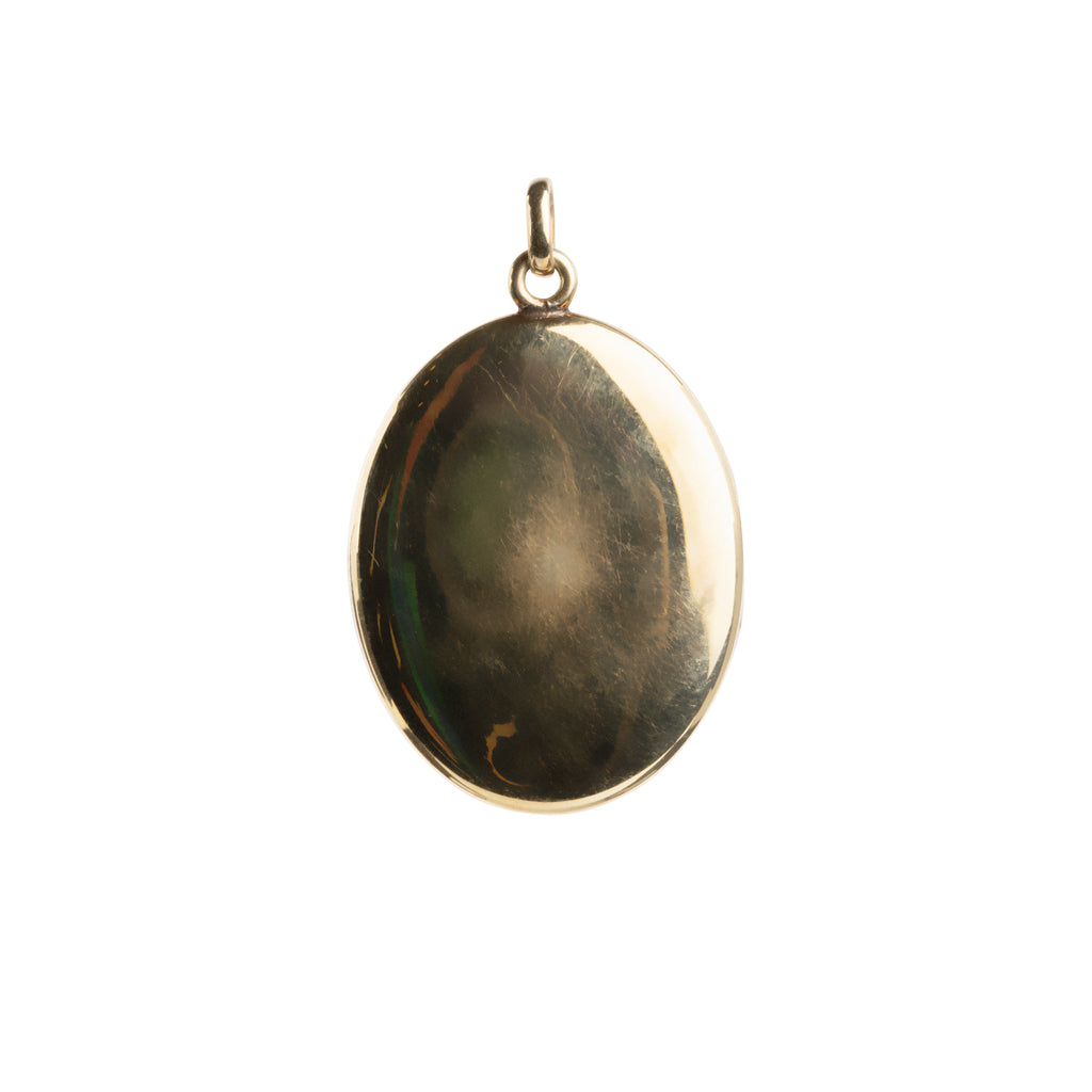 Turn of the century era black enamel and old mine cut diamond locket, in 15k gold. The original frame is still intact. Personal images can be placed in the locket.English in Origin. Circa 1900.