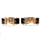 In the 19th century, the Lilly of the Valley flower was a common mourning motif that symbolized a return to happiness. This is a nicely preserved set of 14k gold bracelets with black enamel, pearls and delicate engraving. They are small in size, measuring 5.25 inches in circumference. American, circa 1870. Side view with claps opened. 
