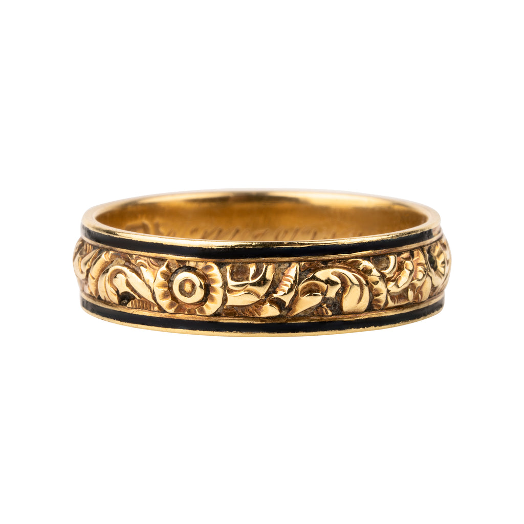 Georgian era chased enamel mourning band in 18k gold. Deeply chased floral details with worn black enamel. English in origin. London hallmarks, and 1821. Side View. 