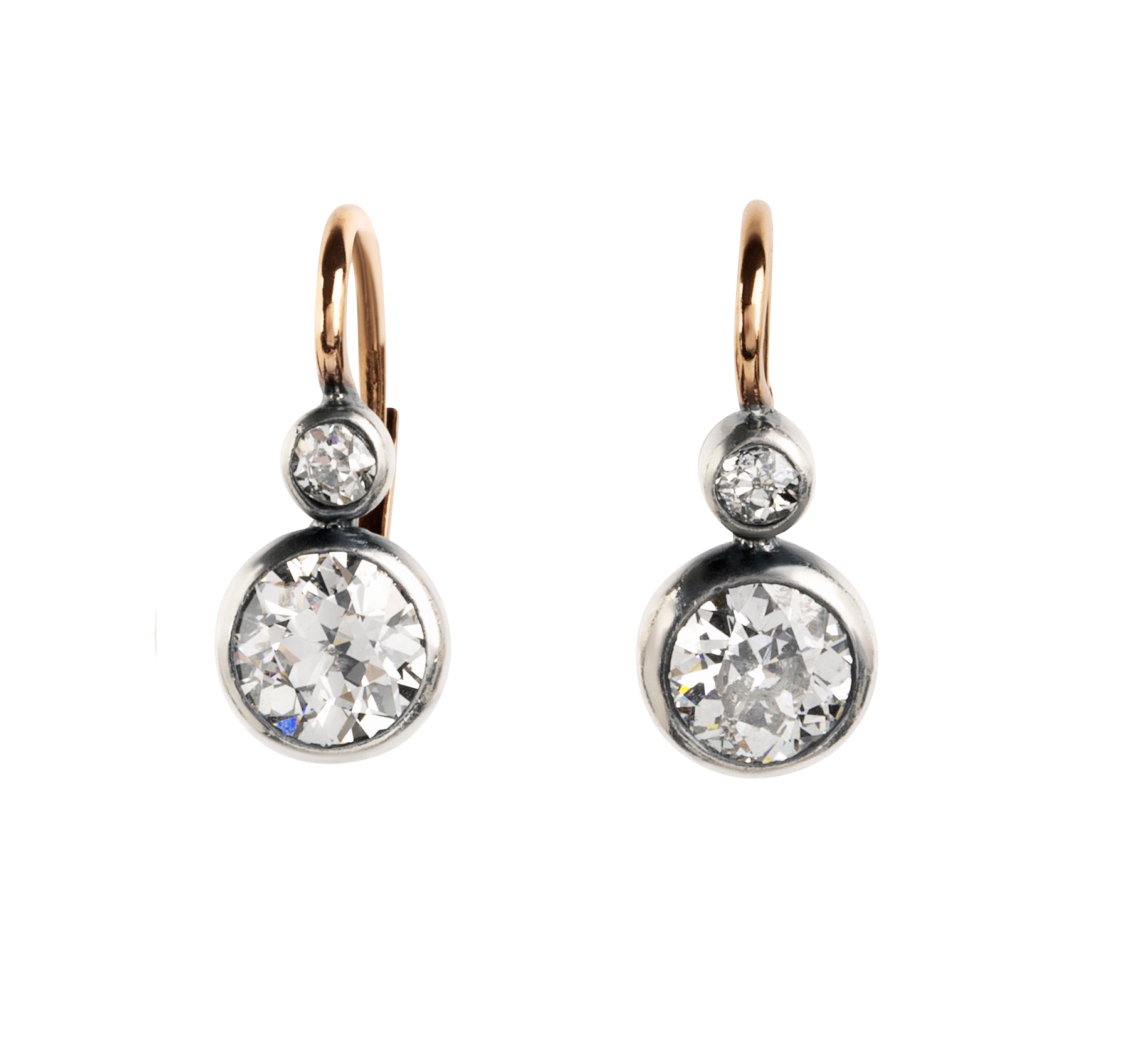 Antique old European cut diamond two-stone earrings. Set in bezel set Silver topped 14k gold. A hand engraved detail on each hook reads "2.75" which is the estimated total diamond weight.The stones are estimated to be J-L in color and I1 in clarity. Front view. 