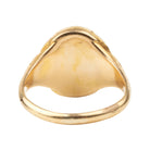 Victorian era deer intaglio signet ring, in 18k gold. Carved bloobstone intaglio depicted a deer holding a brand of leaves set in an engraved gold ring. England. Circa 1870.