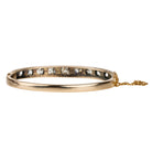 Victorian revival diamond bangle, in silver topped 15k gold. Eleven graduated old European cut diamonds, approximately 4 carats in total diamond weight. Found in Finland. European in origin. Circa 1920.&nbsp;