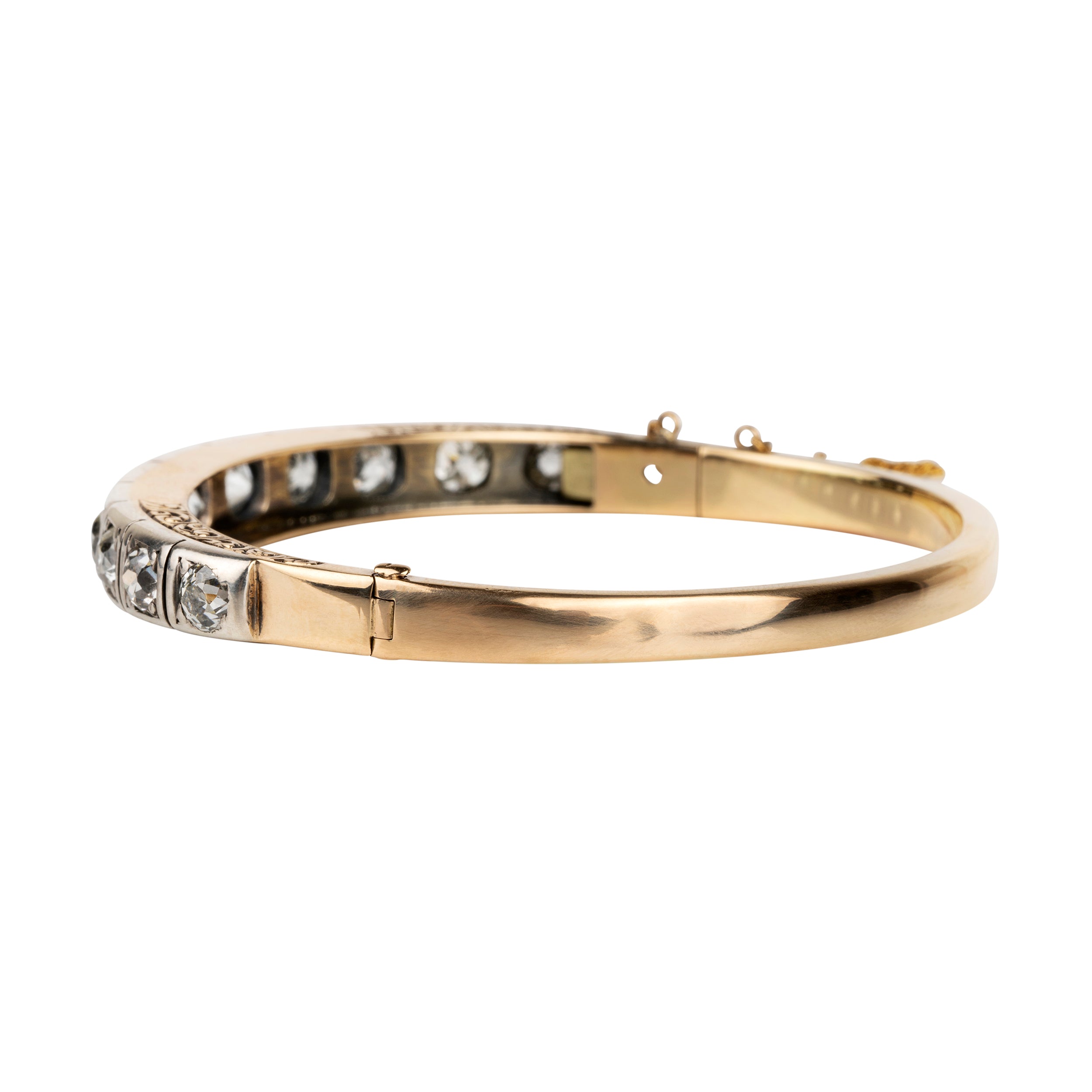Victorian revival diamond bangle, in silver topped 15k gold. Eleven graduated old European cut diamonds, approximately 4 carats in total diamond weight. Found in Finland. European in origin. Circa 1920.&nbsp;