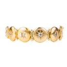 Antique diamond and gold bracelet, in 10k gold. Seven old mine cut diamonds in star detail settings. Approximately .75 carat in total diamond weight. American in origin. Circa 1900.