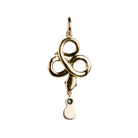 Rose cut diamonds are set&nbsp; in silver topped gold in the form of a snake. The snake is coiled into a trefoil design with a tear drop shaped diamond drop. The detail extends to two tiny ruby eyes. The piece appears to have been converted into a pendant from a brooch or stick pin. England, Circa 1820. Back side view. 