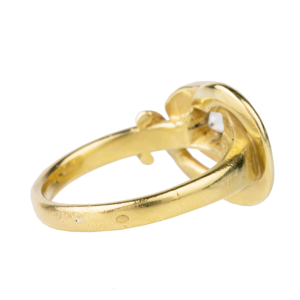 Victorian era diamond snake ring in 18k gold. An approximately 0.80 carat antique old European cut diamond in the head. English in origin. Circa 1890. Side view. 