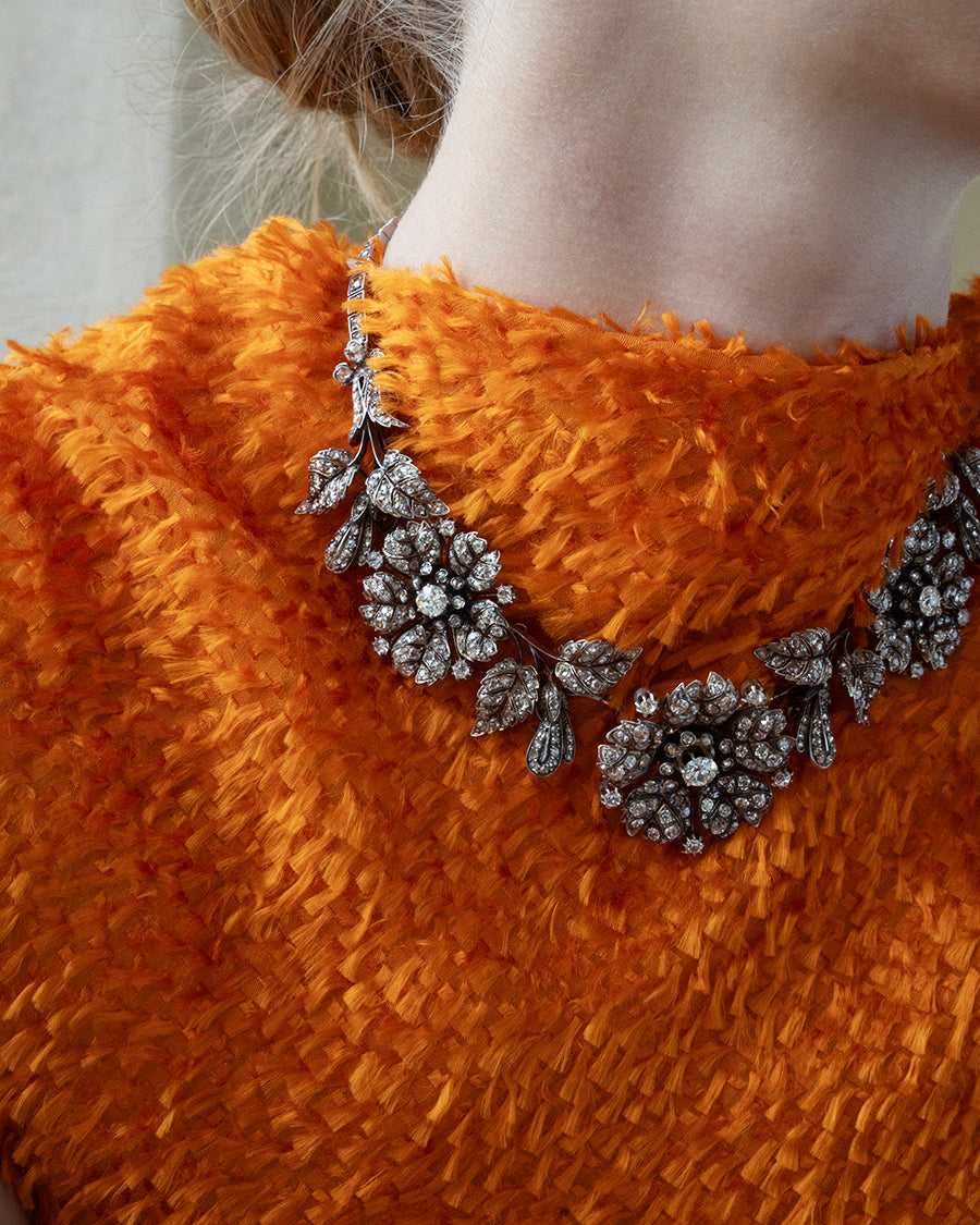 A model wearing an 19th century diamond floral necklace. 