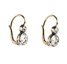 Antique old European cut diamond two-stone earrings. Set in bezel set Silver topped 14k gold. A hand engraved detail on each hook reads "2.75" which is the estimated total diamond weight.The stones are estimated to be J-L in color and I1 in clarity. Front view. Side view. 