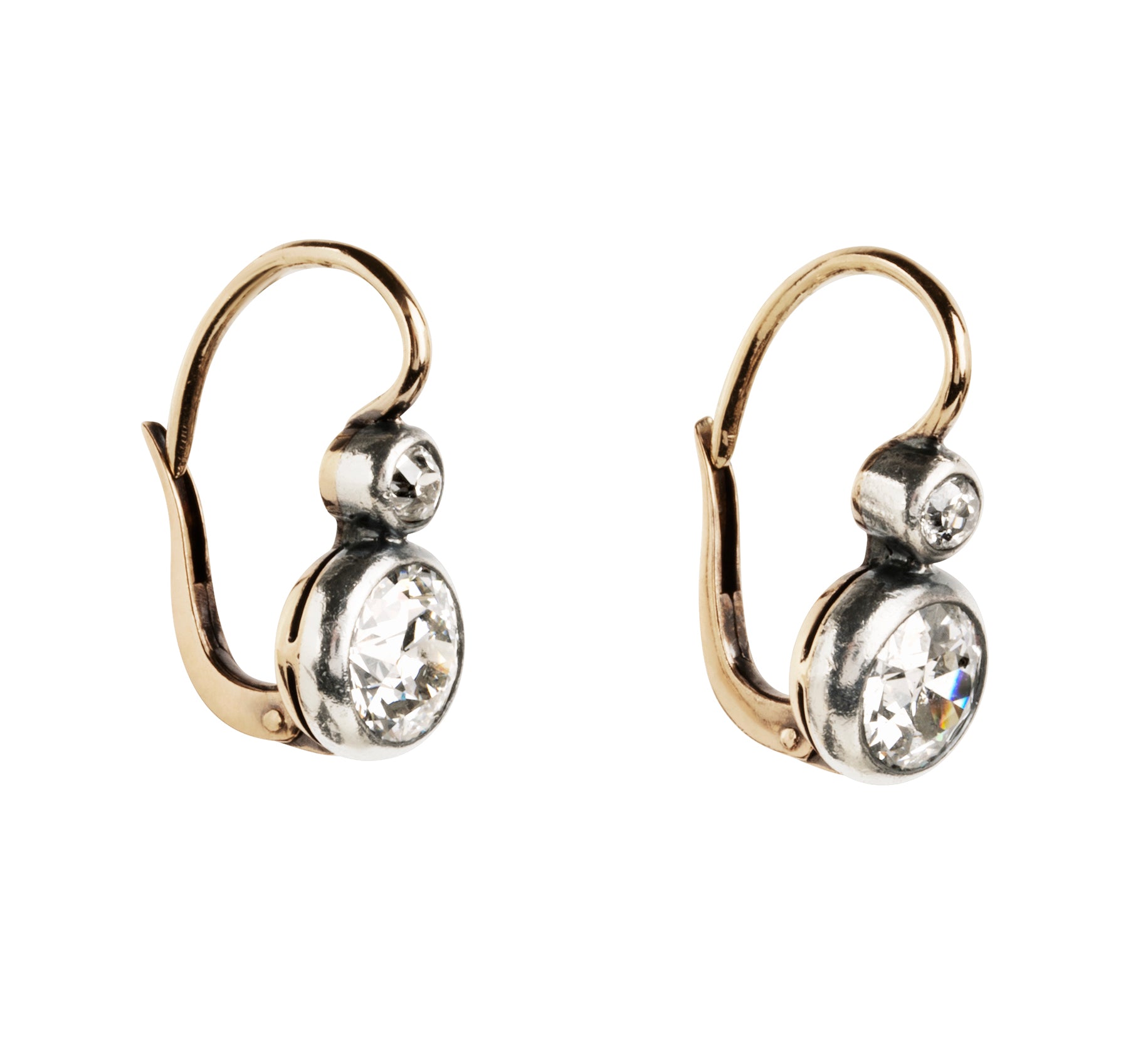 Antique old European cut diamond two-stone earrings. Set in bezel set Silver topped 14k gold. A hand engraved detail on each hook reads "2.75" which is the estimated total diamond weight.The stones are estimated to be J-L in color and I1 in clarity. Front view. Side view. 
