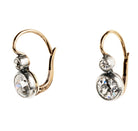Antique old European cut diamond two-stone earrings. Set in bezel set Silver topped 14k gold. A hand engraved detail on each hook reads "2.75" which is the estimated total diamond weight.The stones are estimated to be J-L in color and I1 in clarity. Side view. 