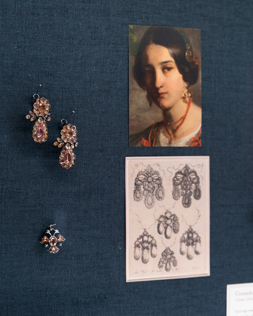 View of antique topaz earrings in our jewelry cases. 