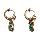 Bell & Bird emerald and diamond earrings in 18k old gold. The earrings feature two GIA certified pear-shaped emeralds, 1.79 carats and 1.99 carats, of Colombian origin, untreated with heat. Paired with four marquise diamonds.