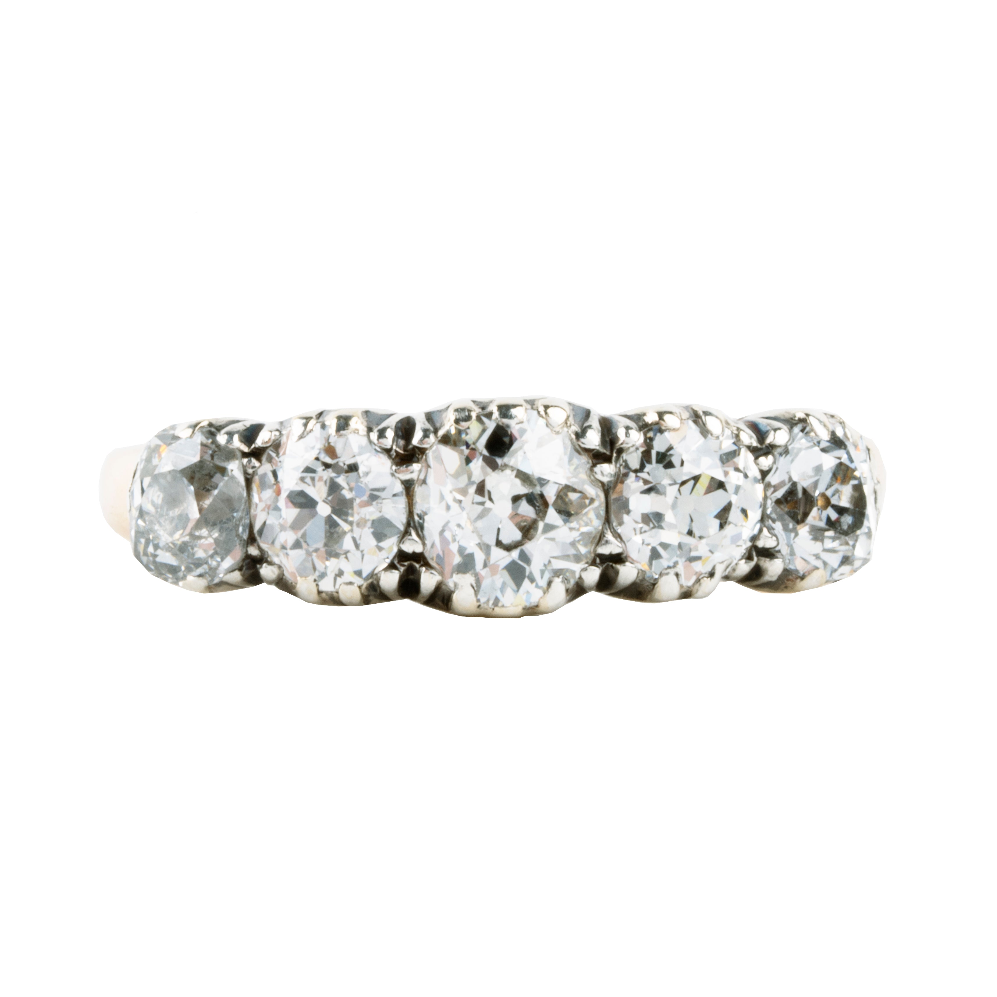 Victorian-era five-stone diamond ring, in a silver-topped gold setting. Five bright old mine-cut diamonds set in cutaway settings. England, circa 1860. Front view. 