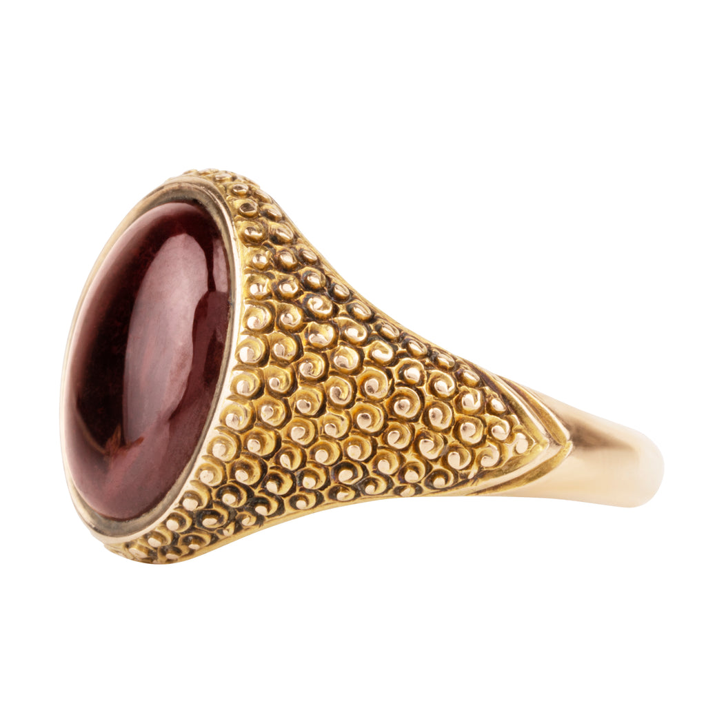 Victorian era garnet cabochon signet ring in 18k gold. Hand engraved "The Jubilee, LC& E, Tabram, Married March 30, 1815." English in origin. Likely made in 1865 celebrating a 50th wedding anniversary. Side profile view. 