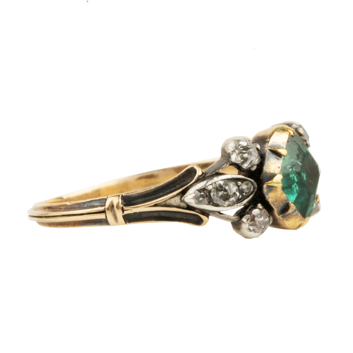 An antique-style gold ring featuring a green emerald-cut center stone and small clear accent stones, set against a plain white background.