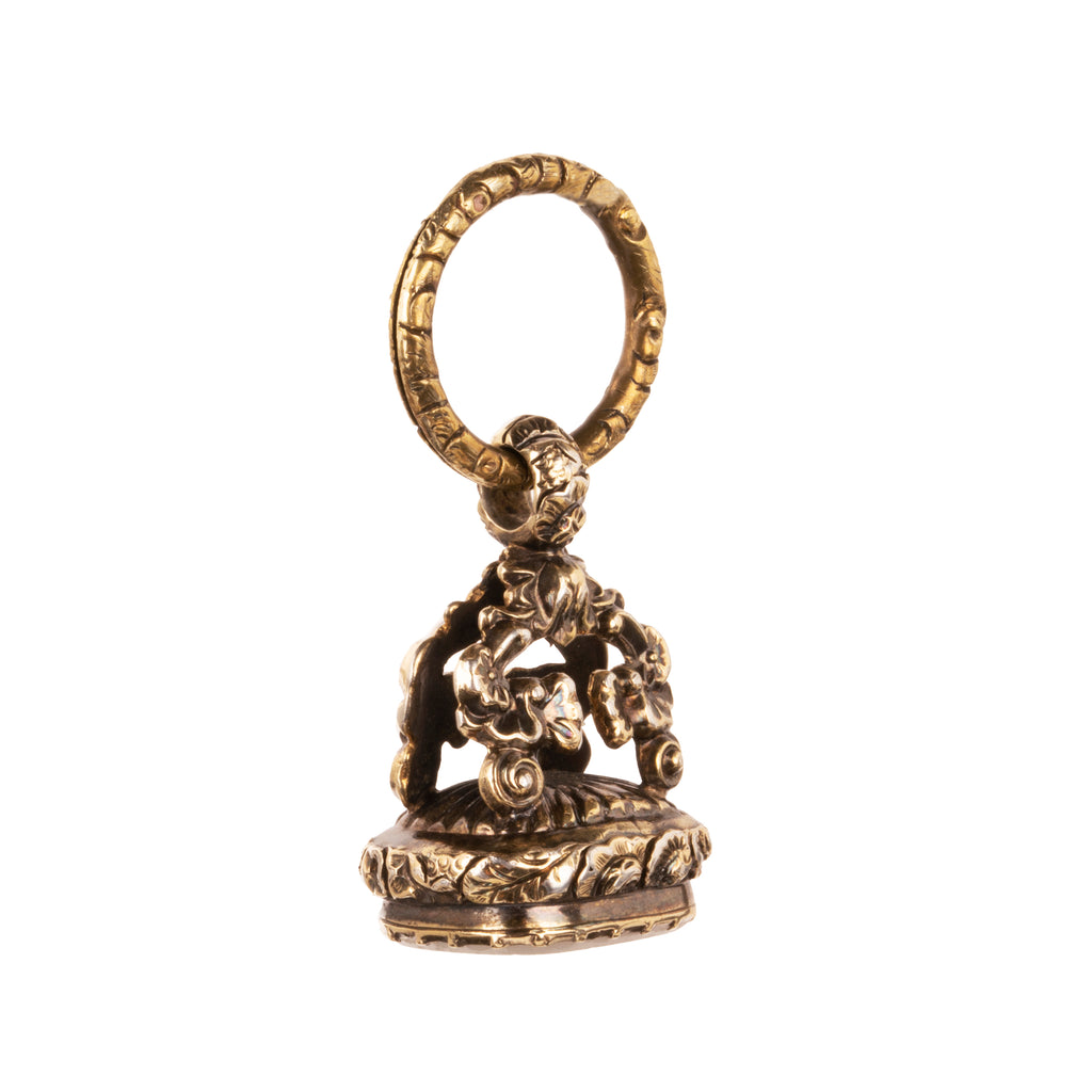 Victorian era watch fob in 9k gold. Carved white agate seal with a rebus puzzle depicting the word “friend” and a ship. English in origin. Circa 1880. Side view of the fob. 