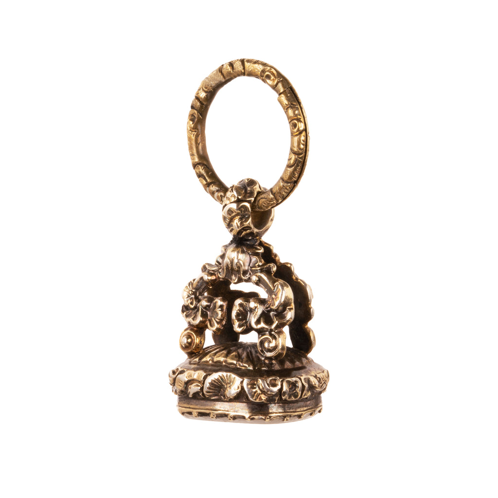 Victorian era watch fob in 9k gold. Carved white agate seal with a rebus puzzle depicting the word “friend” and a ship. English in origin. Circa 1880. Side view of the fob. 