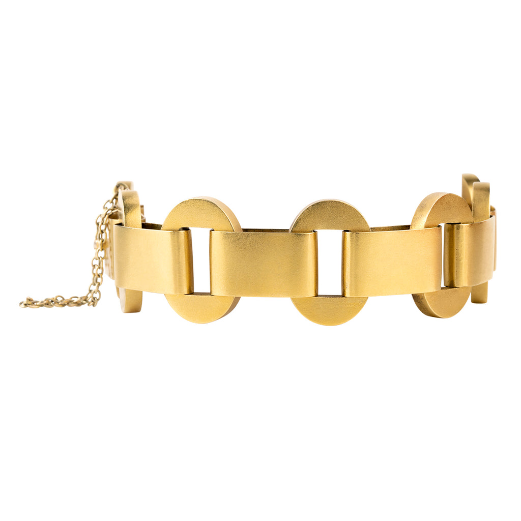 Victorian era gold chain bracelet with a bright bloomed finish in 18k yellow gold. Hollow links in a bold design form the chain. England. Circa 1880. Side view. 