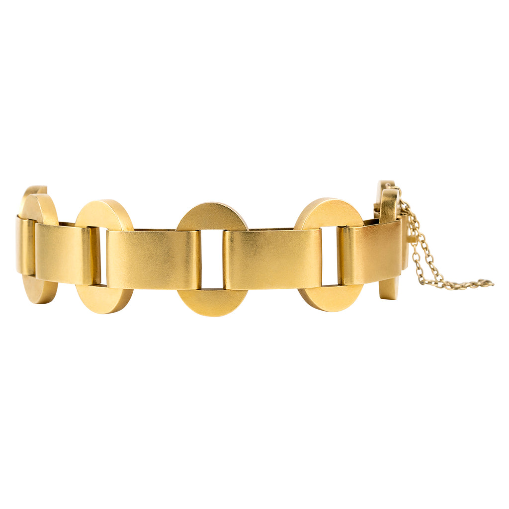 Victorian era gold chain bracelet with a bright bloomed finish in 18k yellow gold. Hollow links in a bold design form the chain. England. Circa 1880. Side view. 