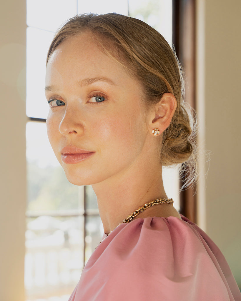 Model wearing our Bell and Bird Diamond hobnail necklace in a pink dress