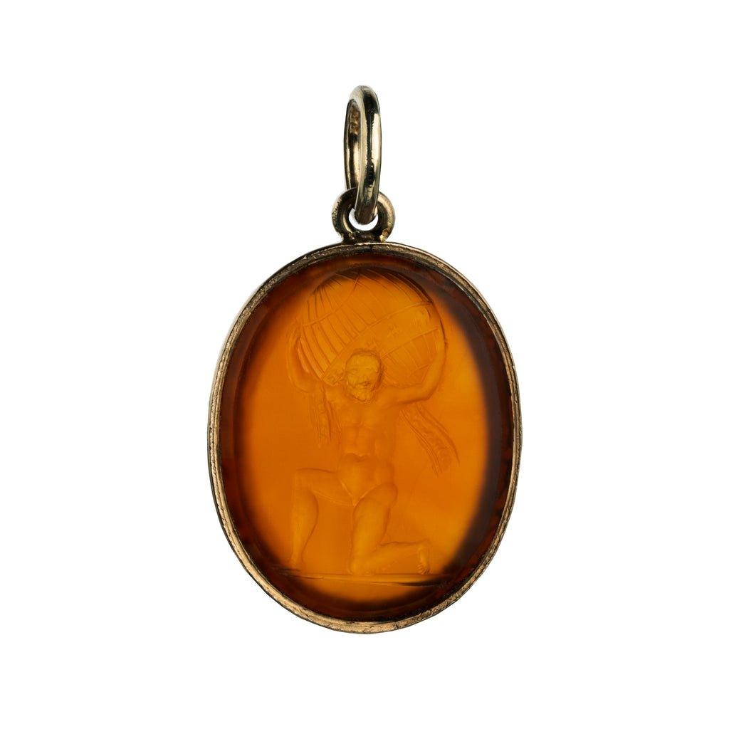 Victorian era carnelian intaglio pendant, in 15k gold.The carving depicts Atlas holding the sky, representing endurance, strength, or commitment. English in Origin. Circa 1830. Front side of the pendant.
