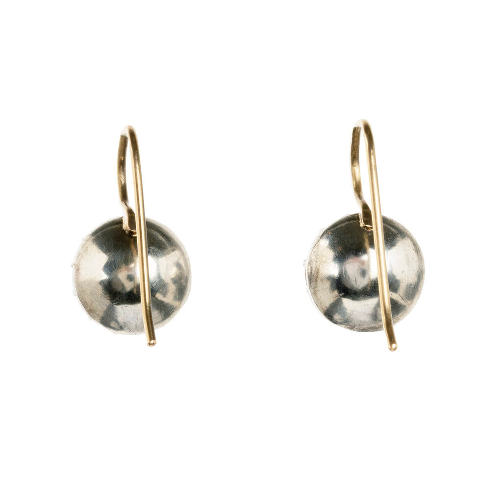 Georgian era white paste earrings, in silver and gold. Round shaped paste stones are set in foiled back silver settings on 18k gold wires. What were once beautiful Georgian era buttons or cufflinks are now perfect everyday earrings.English in origin. Circa 1820. back view. 