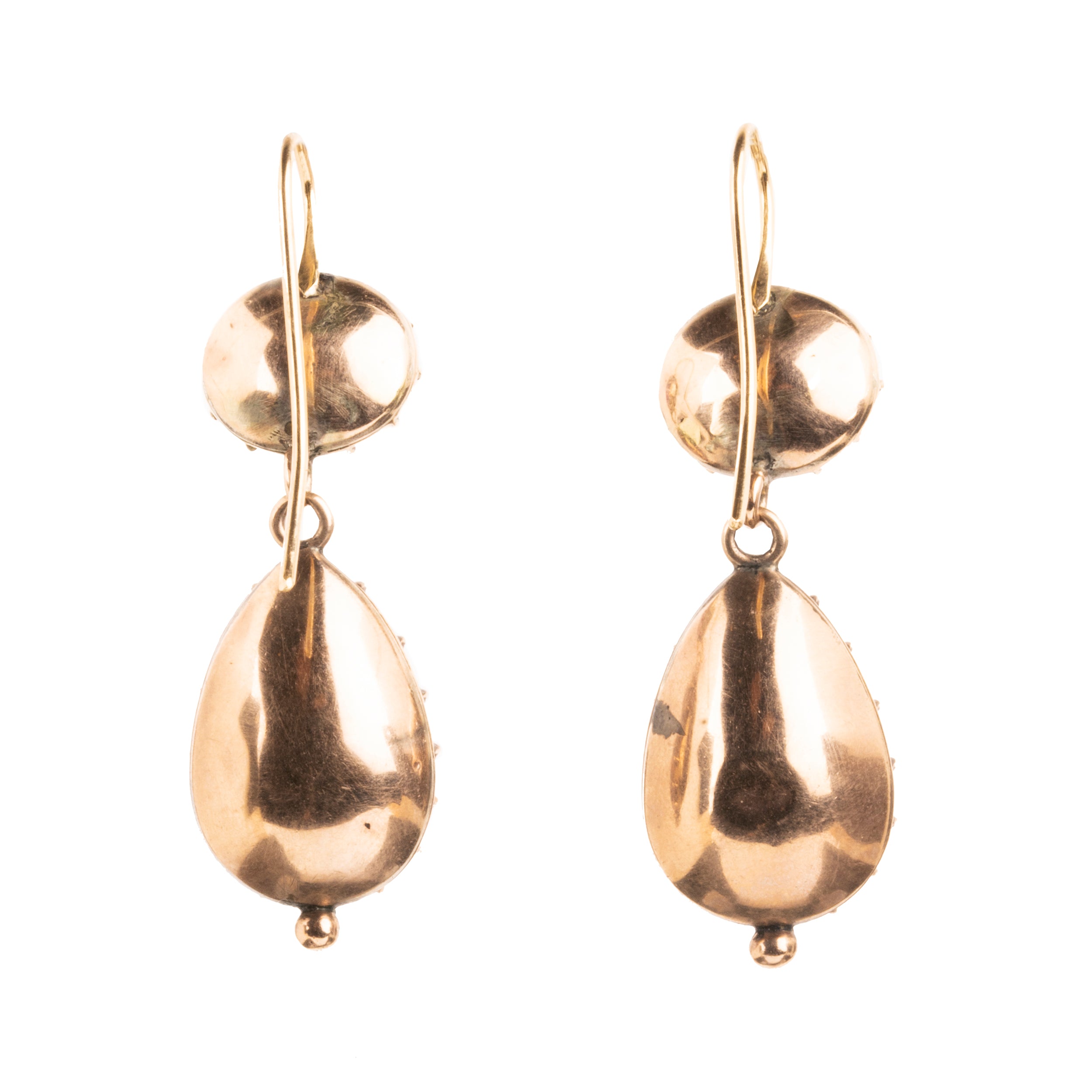 Lovely early 19th century earrings set in 15k gold. Cushion and pear shaped amethyst stones set in closed-back collet settings. The stones are a pale purple, with varied shades of purple and pink coming from the foil behind the stones. The coloring is very unique. English in origin. Circa 1800. Back side of earrings. 