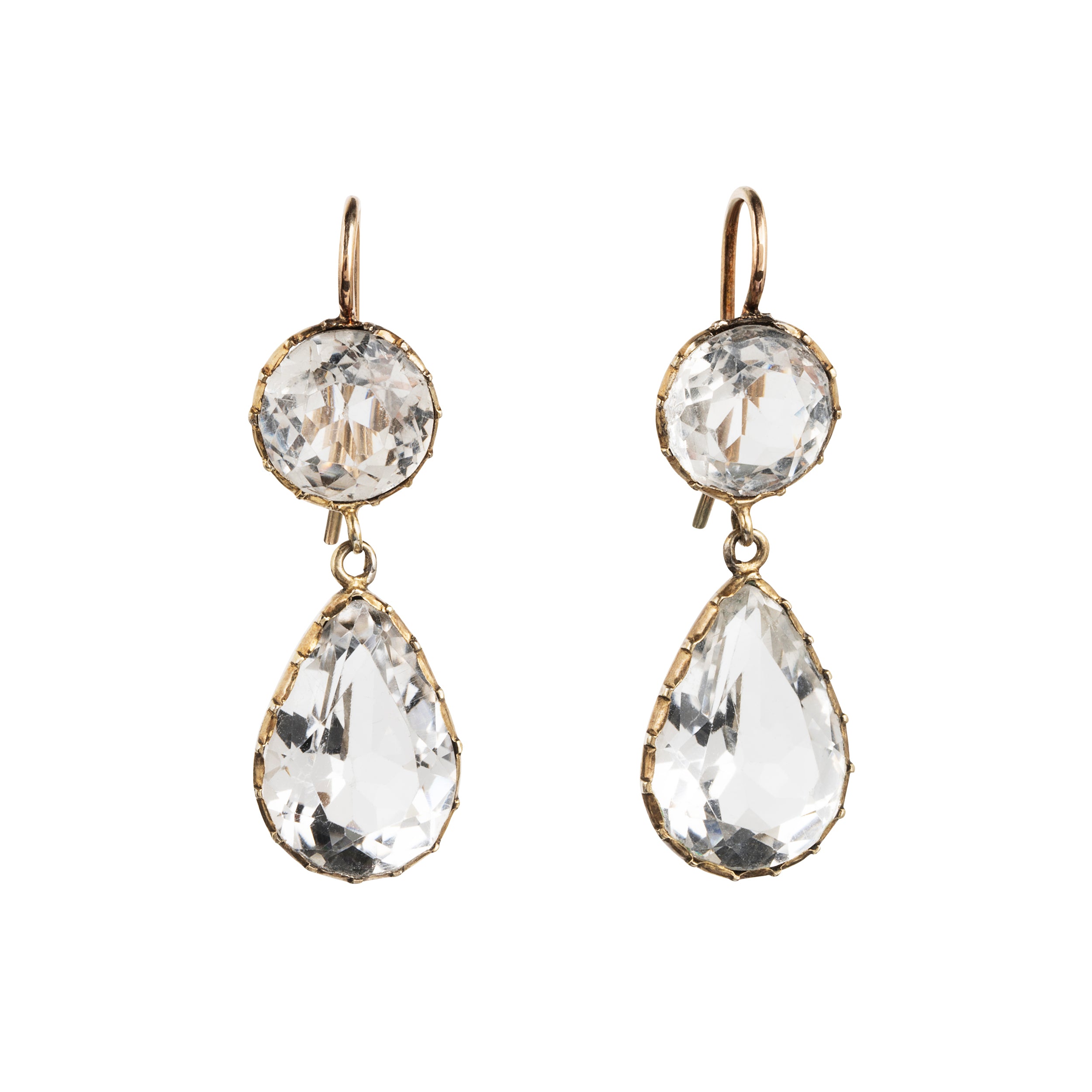Victorian era rock crystal tear drop earrings. The stones are set in open back cut-down silver gilt settings. England. Circa 1880.