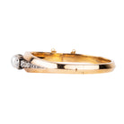 Approximately three carats of rose-cut diamonds are set in silver cut-away settings. The twenty diamonds flank a single natural pearl. The stones taper into a knife-edge detail in 18k rose gold. Continental Europe, circa 1860. Side view. 