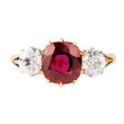 A classic ruby and diamond ring three stone ring. The ring features a natural red 2.11 carat ruby certified to have no treatment and be of Thai origin. The primary stone is flanked by two old European cut diamonds weighing approximately .5 carat each. The ring is set in 18k yellow gold and platinum.&nbsp; English in Origin. Circa 1910. The stone holds a certificate from GCS laboratory in London. Certificate number:5784-2538. Front view. 