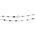 Art Deco sapphire spectacle set platinum chain. Marquise shaped blue sapphires set in bezel settings. American. Circa 1920.