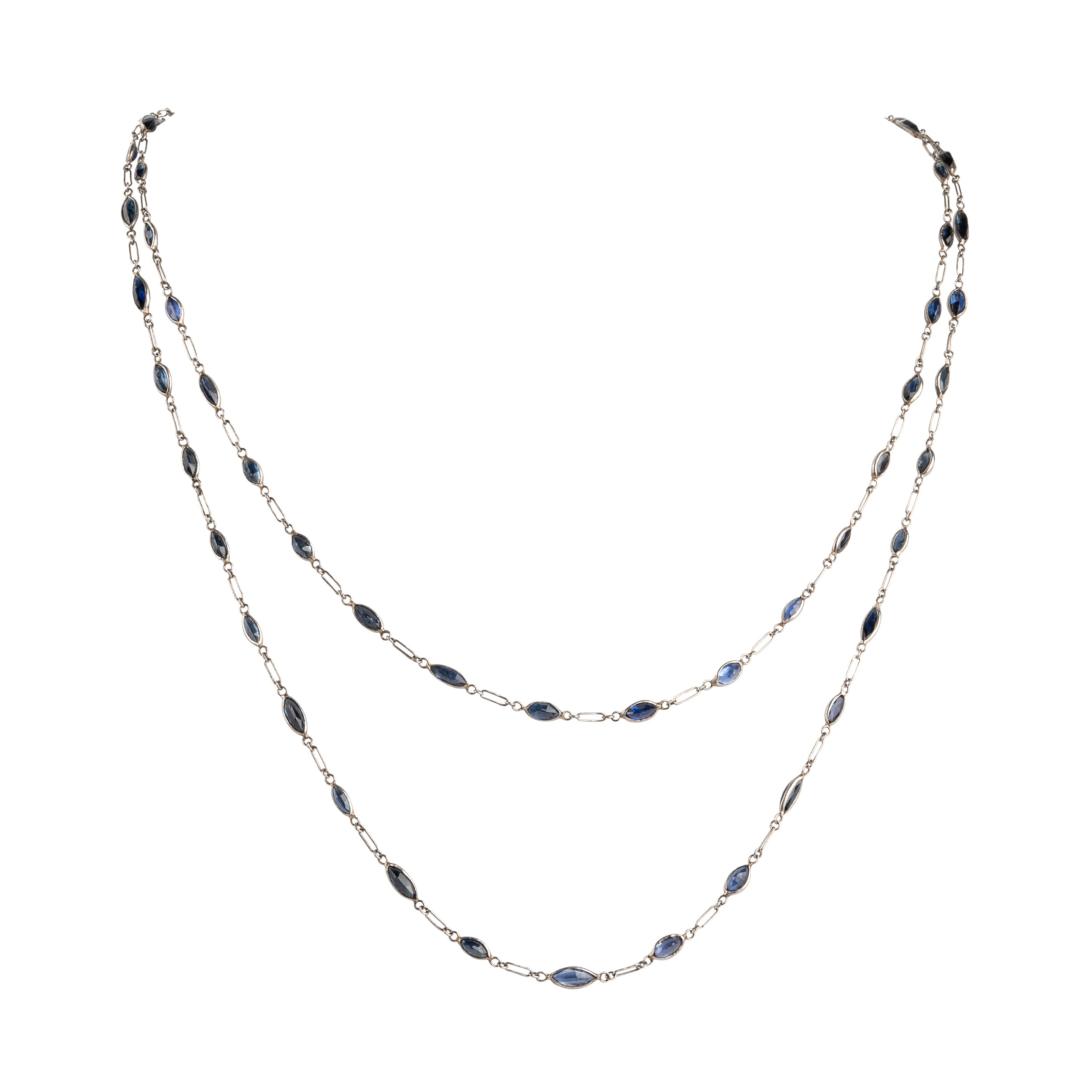 Art Deco sapphire spectacle set platinum chain. Marquise shaped blue sapphires set in bezel settings. American. Circa 1920.