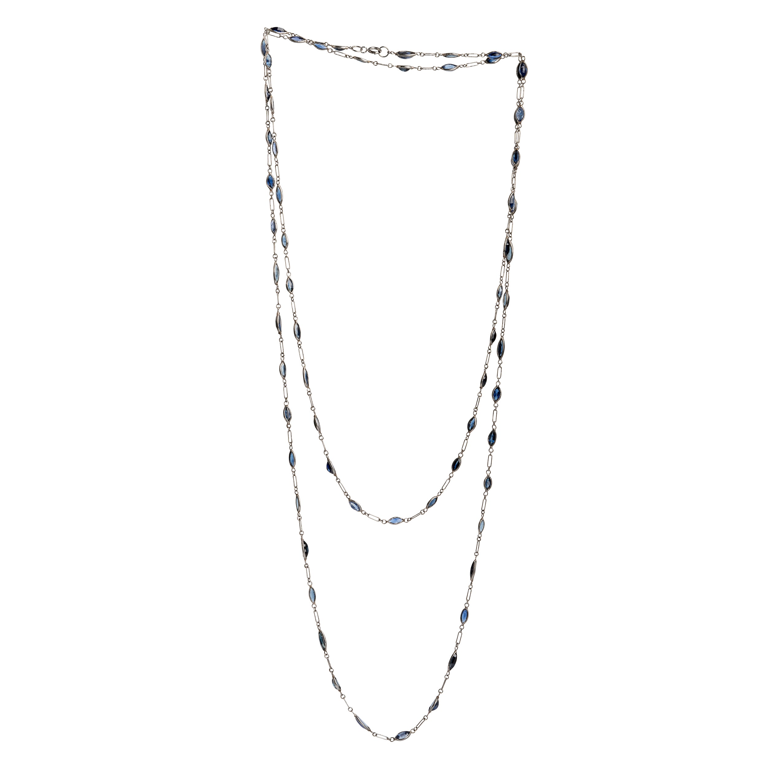 Art Deco sapphire spectacle set platinum chain. Marquise shaped blue sapphires set in bezel settings. American. Circa 1920.