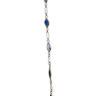 Art Deco sapphire spectacle set platinum chain. Marquise shaped blue sapphires set in bezel settings. American. Circa 1920.
