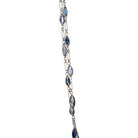 Art Deco sapphire spectacle set platinum chain. Marquise shaped blue sapphires set in bezel settings. American. Circa 1920.