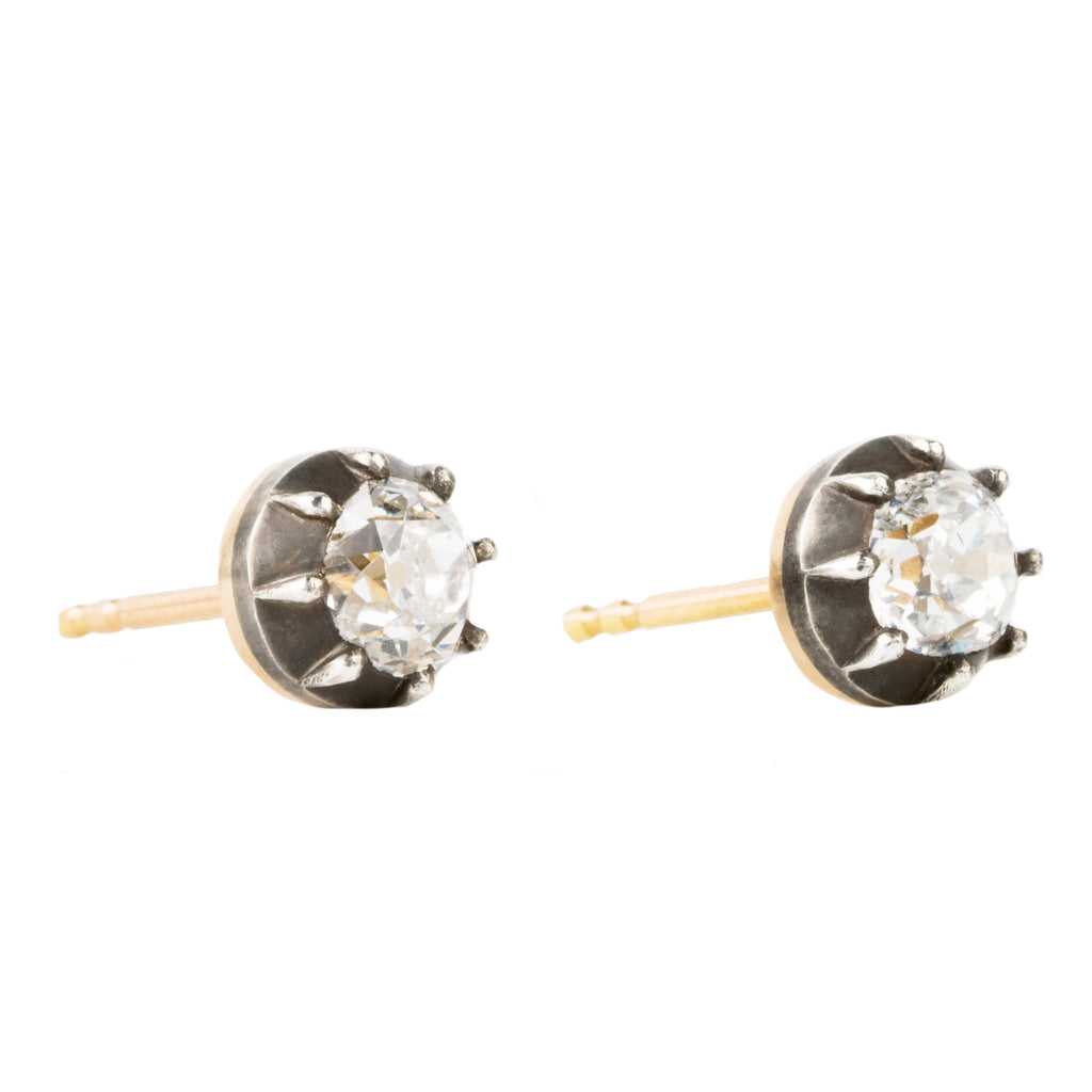 Our design for these earrings is inspired by Georgian and Victorian Era cutaway settings. Entirely hand fabricated they feature silver topped gold cutaway collet settings. This is a labor-intensive setting technique common in 18th and 19th century. These demure earrings feature two old mine cut diamonds, approximately 1.06 carats in total diamond weight , H-I color and SI1 / SI2 clarity. Hand engrave Bell &amp; Bird markers mark. Side view. 