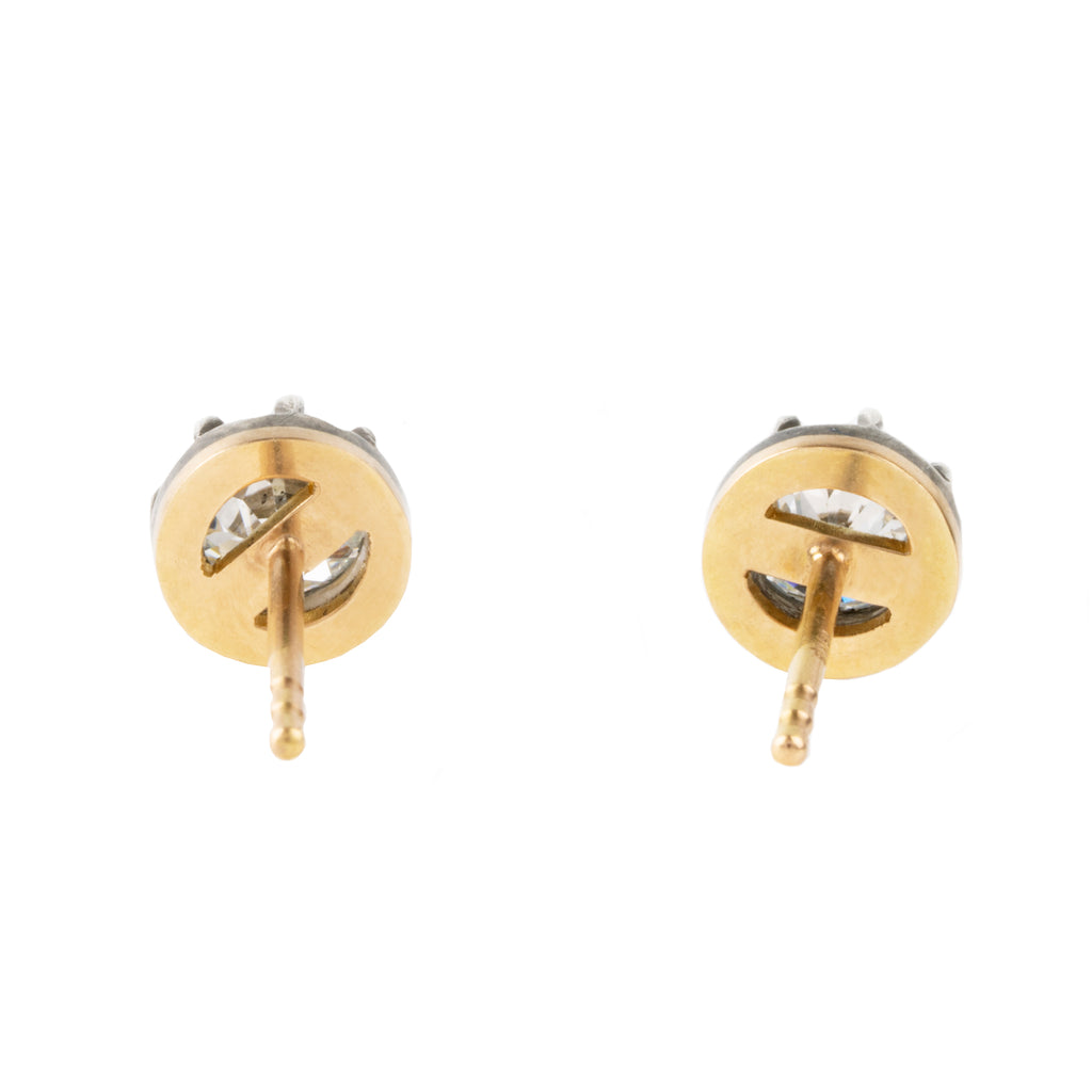 Our design for these earrings is inspired by Georgian and Victorian Era cutaway settings. Entirely hand fabricated they feature silver topped gold cutaway collet settings. This is a labor-intensive setting technique common in 18th and 19th century. These demure earrings feature two old mine cut diamonds, approximately 1.06 carats in total diamond weight , H-I color and SI1 / SI2 clarity. Hand engrave Bell &amp; Bird markers mark. back view. 