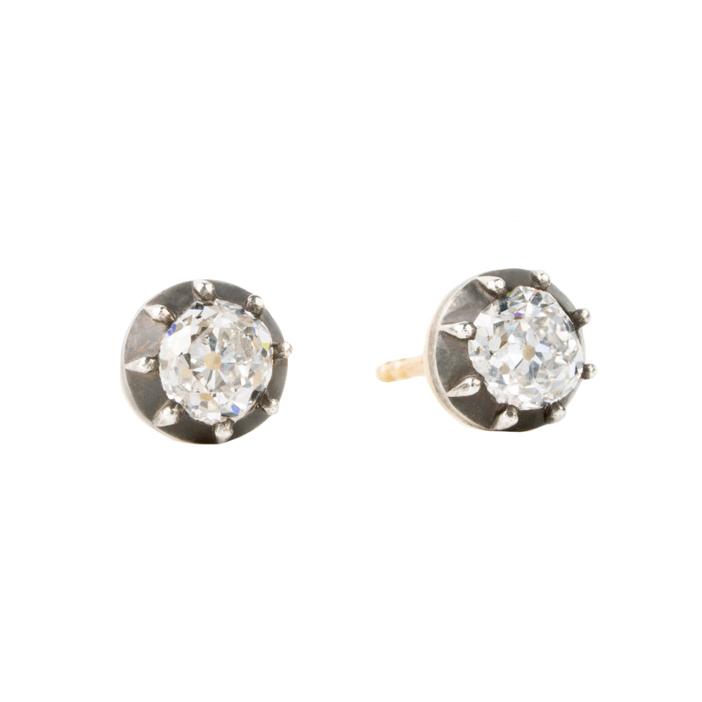Our design for these earrings is inspired by Georgian and Victorian Era cutaway settings. Entirely hand fabricated they feature silver topped gold cutaway collet settings. This is a labor-intensive setting technique common in 18th and 19th century. These demure earrings feature two old mine cut diamonds, approximately 1.06 carats in total diamond weight , H-I color and SI1 / SI2 clarity. Hand engrave Bell &amp; Bird markers mark. Side view. 